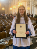 Phoebe, Head Chorister of the Girls' Choir, receives her Gold Award at St Paul's Cathedral