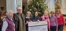 2025_12_17 Xmas fair team present cheque to Hospice